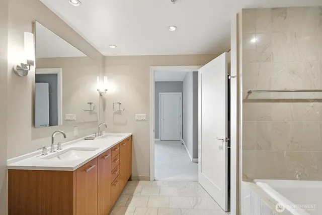 a bathroom with a sink double vanity and a mirror