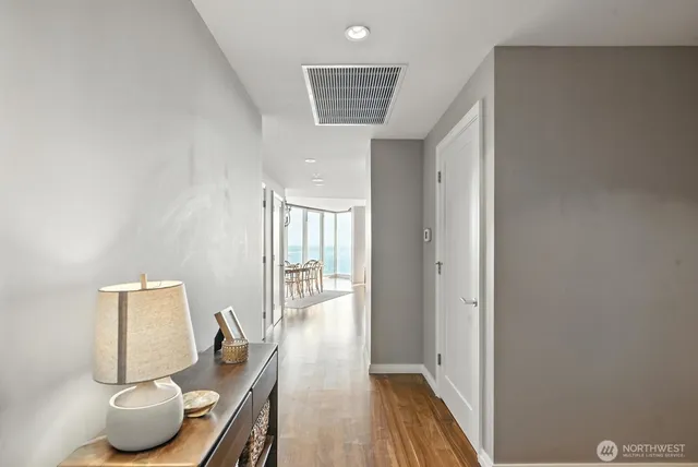 a view of a workspace with furniture and wooden floor