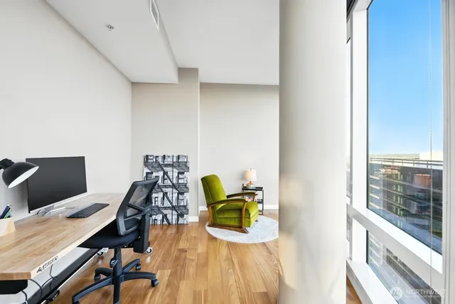 a outdoor space with lots of tables a chairs and a potted plant