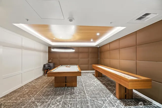 a living room with fireplace furniture and a large window