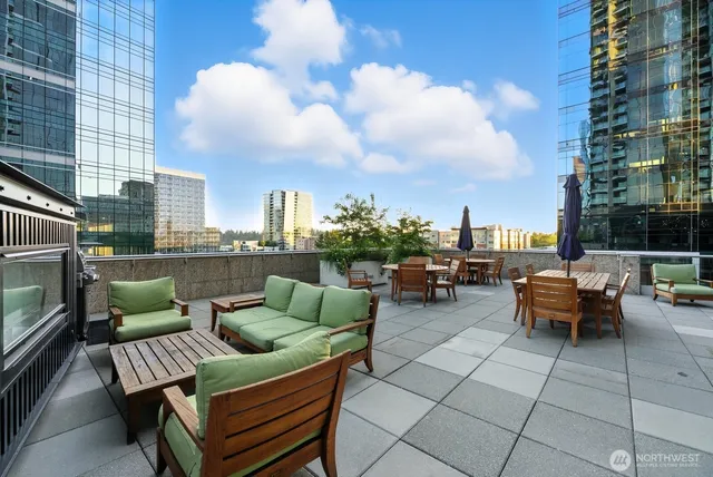 a view of a patio with a dining table and chairs