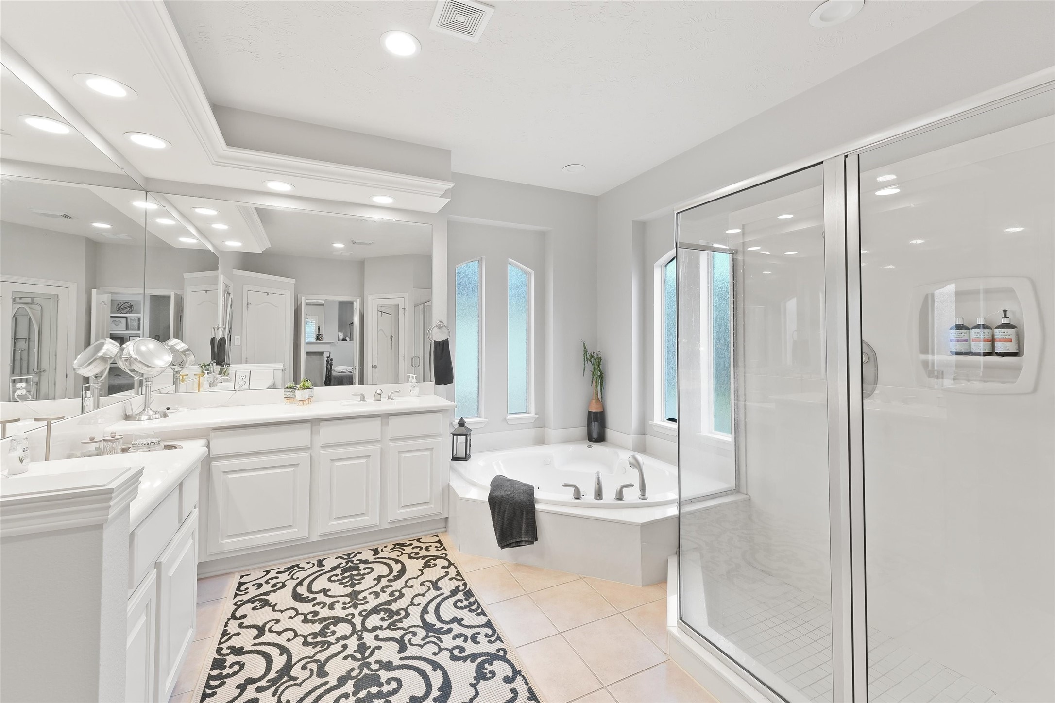 2818 Shallow Springs Court Manvel, TX 77578 - Photo 21 of 41 a bathroom with a double vanity sink mirror and shower