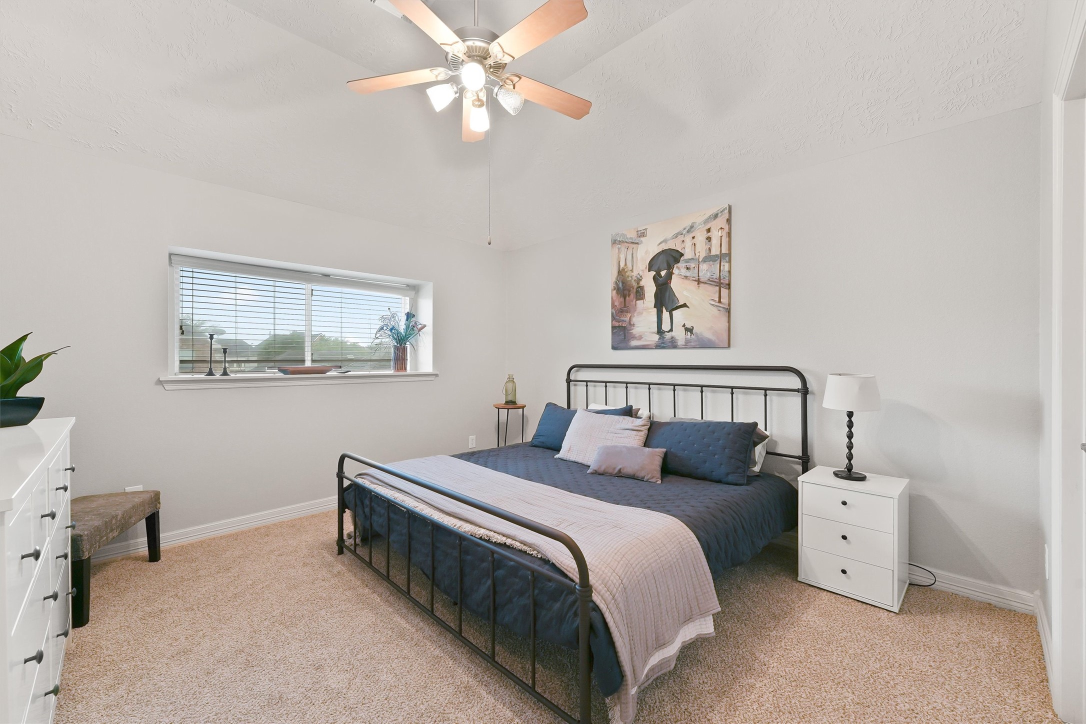 2818 Shallow Springs Court Manvel, TX 77578 - Photo 25 of 41 a bed room with a bed and a chandelier