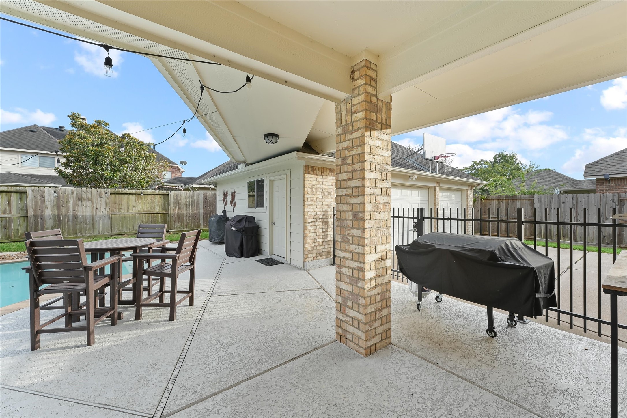 2818 Shallow Springs Court Manvel, TX 77578 - Photo 32 of 41 a view of a patio with a table and chairs