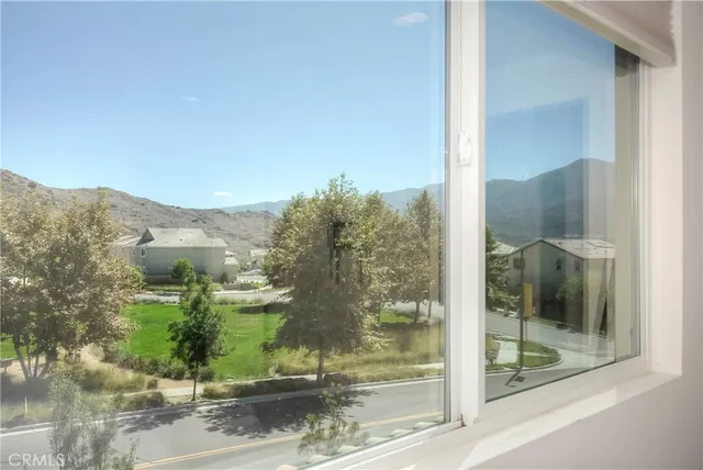 a view of a glass door and a window