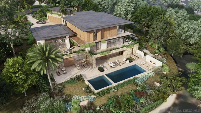 an aerial view of a house with balcony and outdoor space