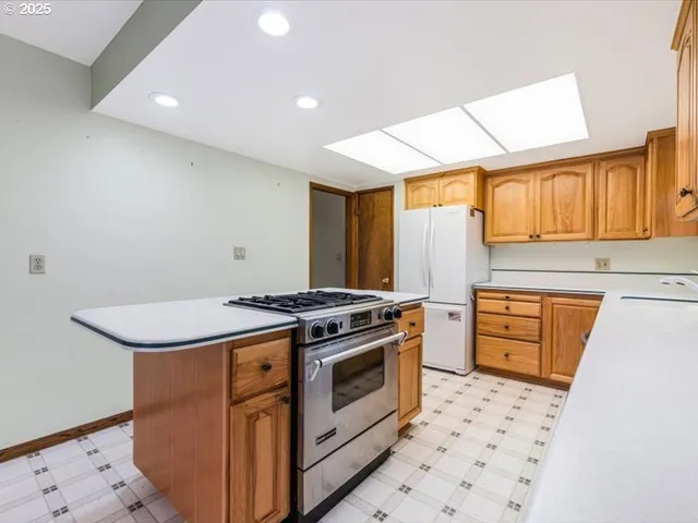 a kitchen with a stove top oven sink and cabinets