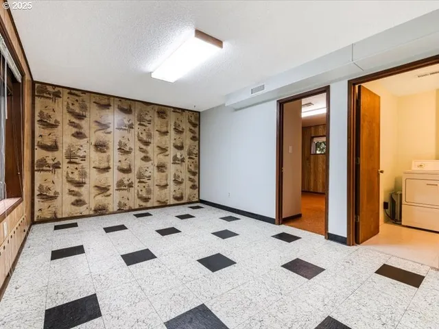 a view of a floor to ceiling window with kitchen view