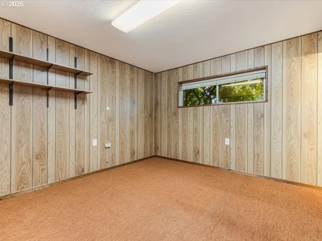 a view of an empty room with a glass door