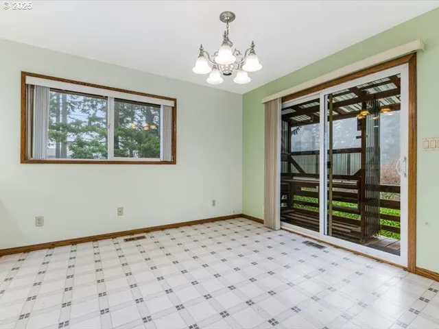 a view of a room with a large window