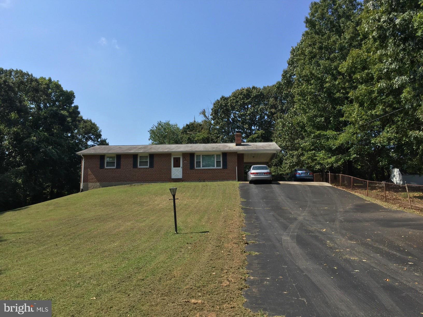 611 Jones Road Severn, MD 21144 - Photo 2 of 28 Set atop a gentle knoll w/ level back yard.