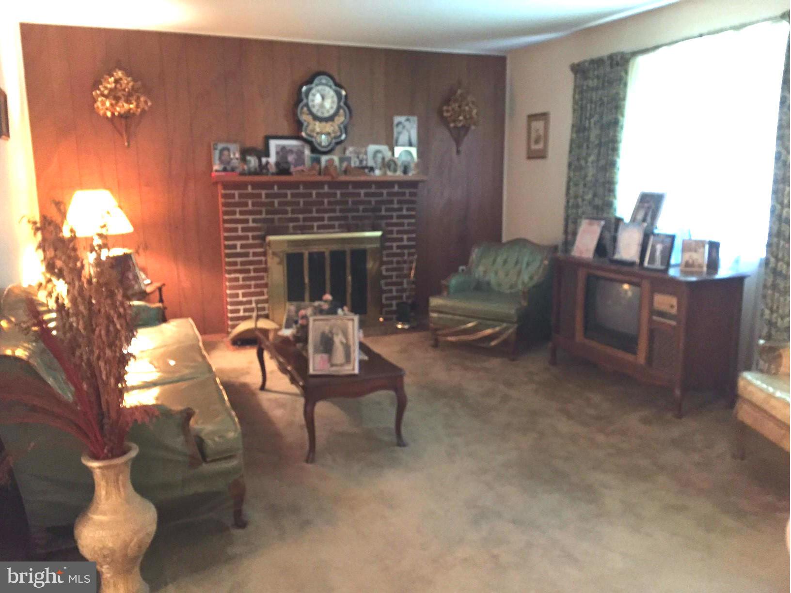 611 Jones Road Severn, MD 21144 - Photo 6 of 28 Living Room with fireplace.