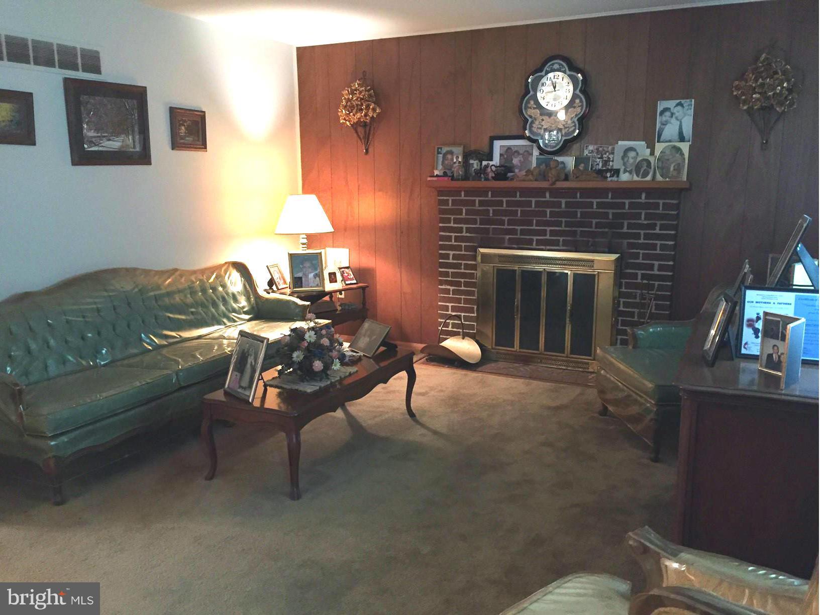 611 Jones Road Severn, MD 21144 - Photo 7 of 28 Hardwoods under all carpeting on main level.