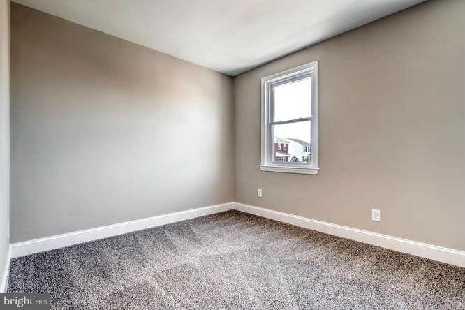 543 Welbrook Road Baltimore, MD 21221 - Photo 14 of 28 an empty room with a window
