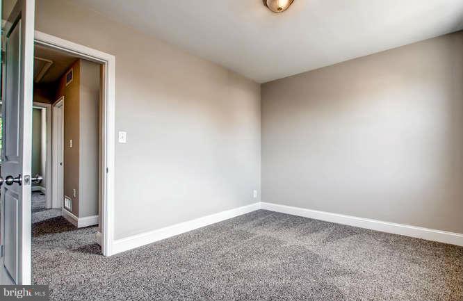 543 Welbrook Road Baltimore, MD 21221 - Photo 16 of 28 wooden floor in an empty room