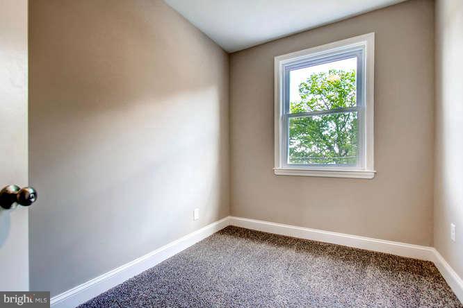 543 Welbrook Road Baltimore, MD 21221 - Photo 18 of 28 an empty room with a window
