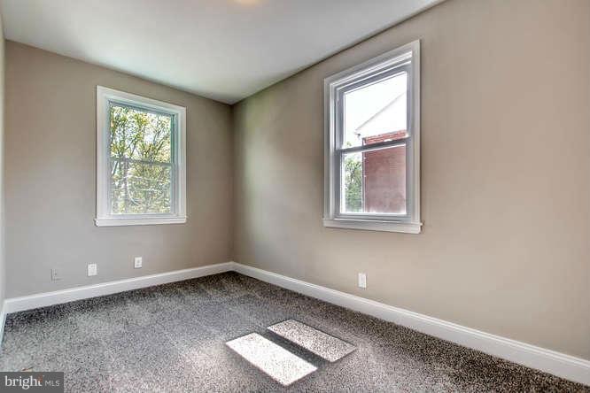 543 Welbrook Road Baltimore, MD 21221 - Photo 20 of 28 an empty room with windows