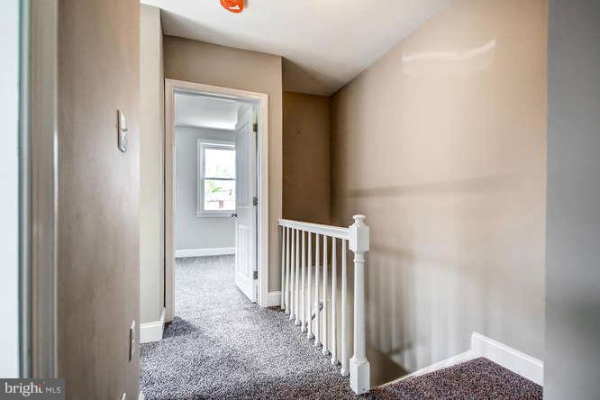 543 Welbrook Road Baltimore, MD 21221 - Photo 22 of 28 a view of a hallway with a livingroom