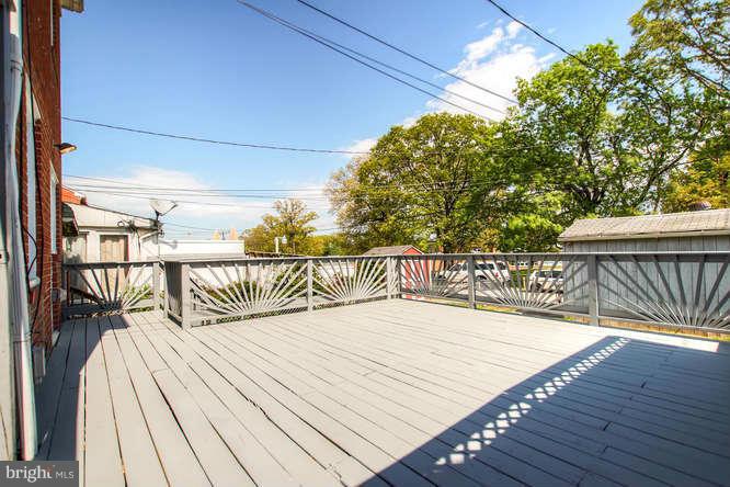 543 Welbrook Road Baltimore, MD 21221 - Photo 25 of 28 a balcony with wooden floor
