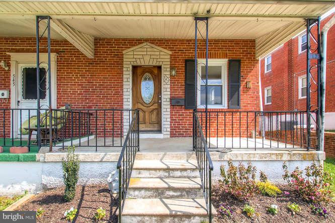 543 Welbrook Road Baltimore, MD 21221 - Photo 4 of 28 a front view of a house with a yard