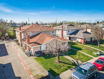 an aerial view of a house with a big yard