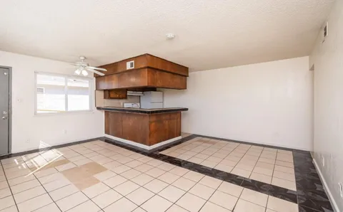 a view of a room with wooden floor and cabinet
