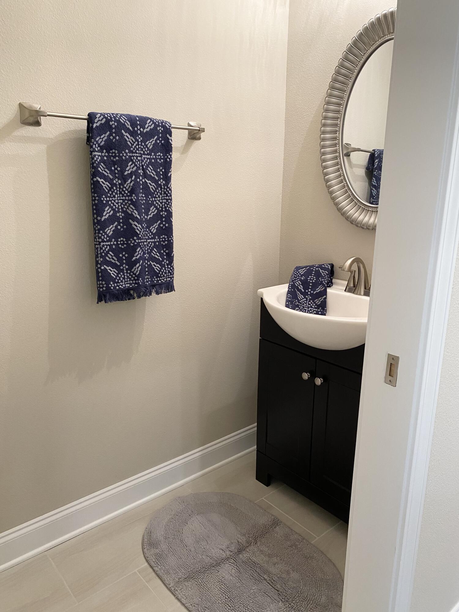 6191 Timberland Ridge Drive Crestview, FL 32539 - Photo 30 of 76 a room with a mirror and a painting on the wall