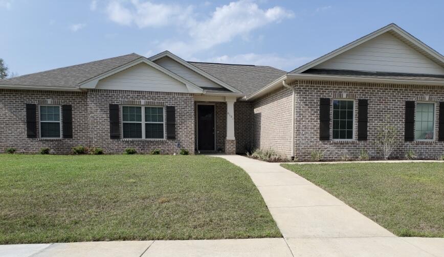 6191 Timberland Ridge Drive Crestview, FL 32539 - Photo 3 of 76 a front view of a house with garden
