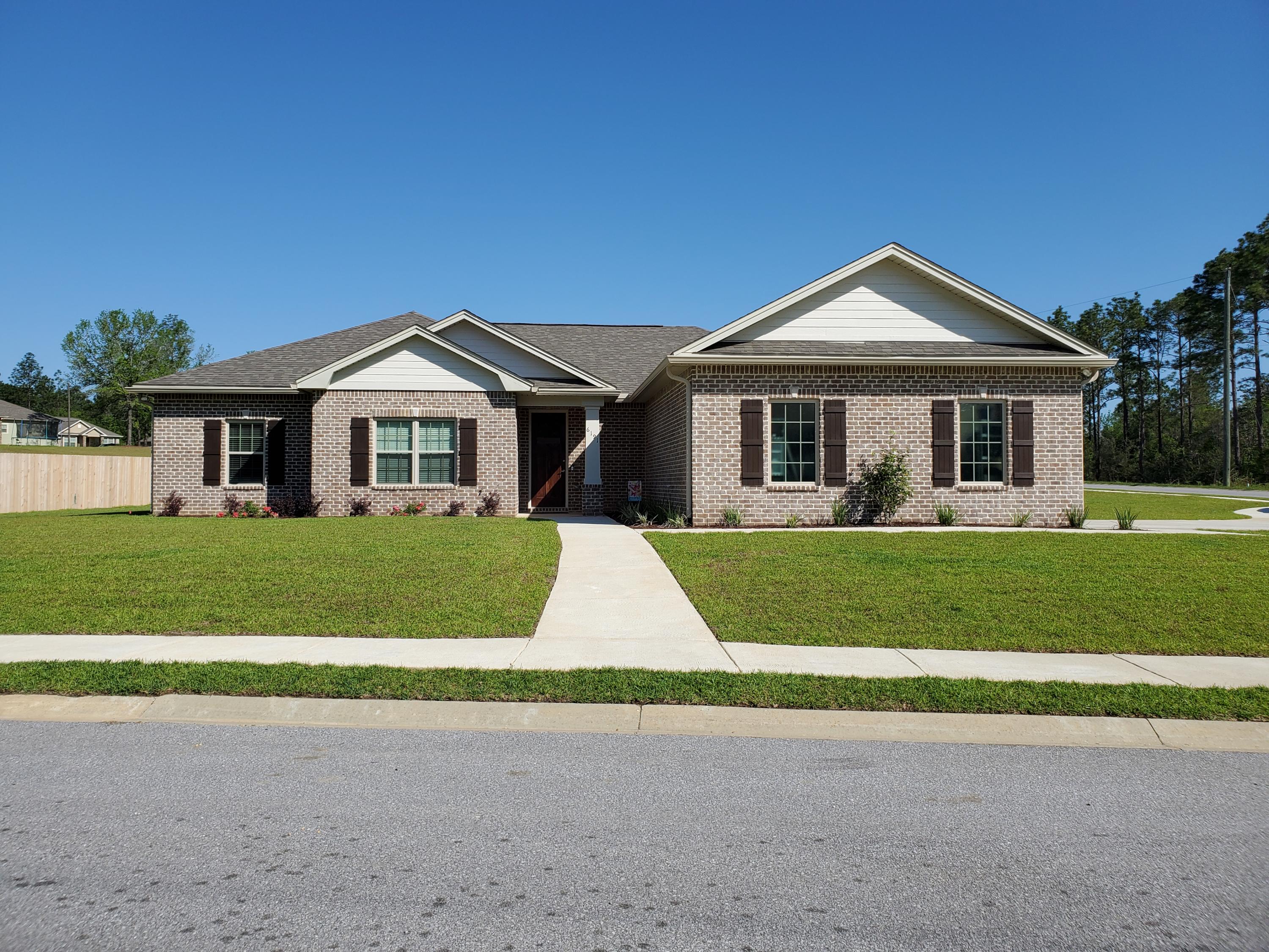 6191 Timberland Ridge Drive Crestview, FL 32539 - Photo 76 of 76 a front view of a house with a yard