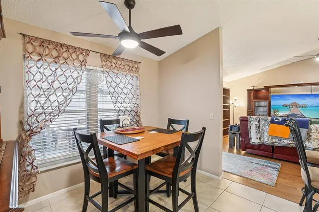 a kitchen with granite countertop a stove and a refrigerator