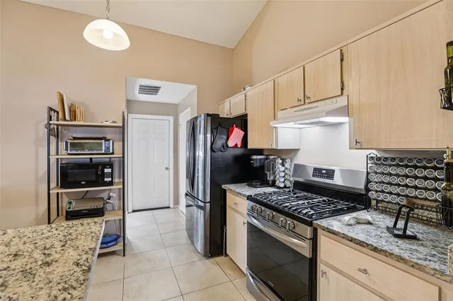 a view of a kitchen and dining room