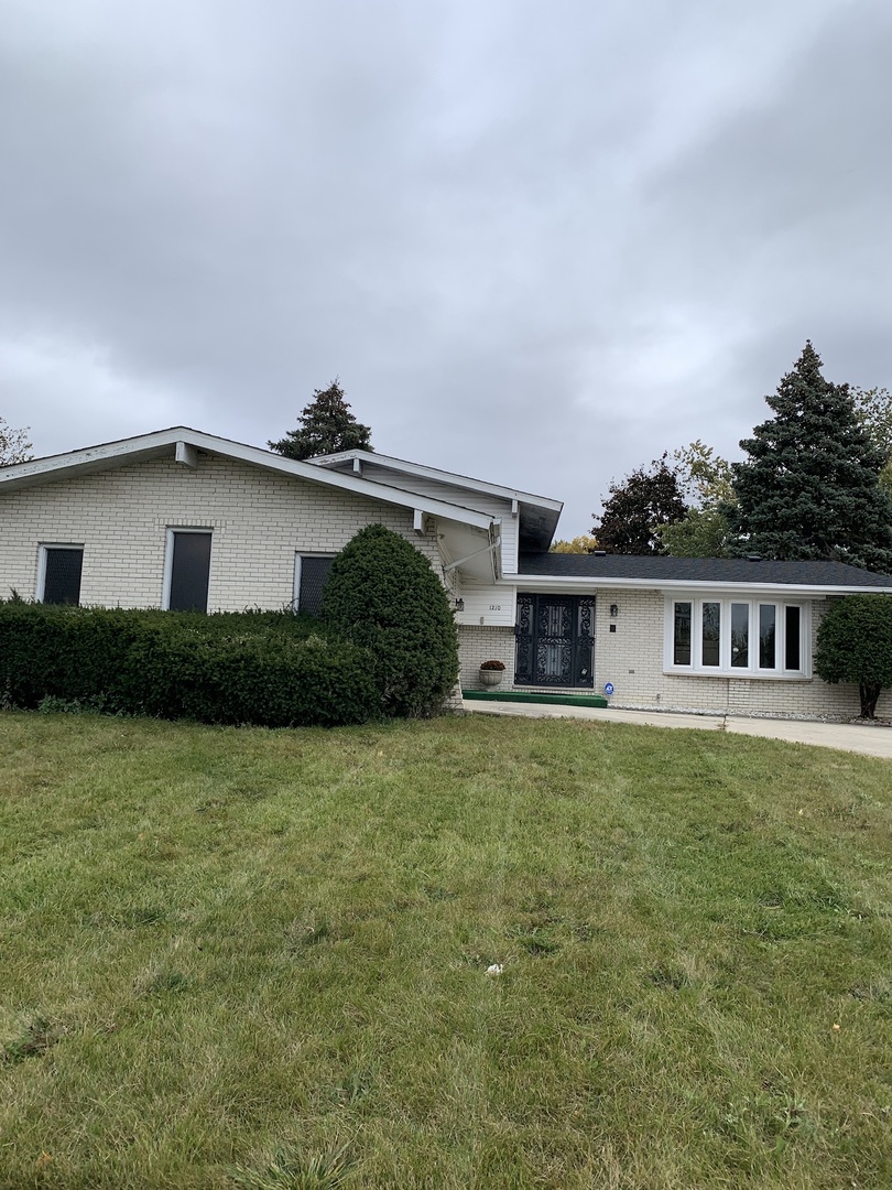 1210 Devonshire Drive Joliet, IL 60435 - Photo 1 of 35 a house view with a garden space