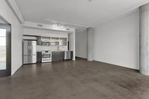 a view of a room with a hallway