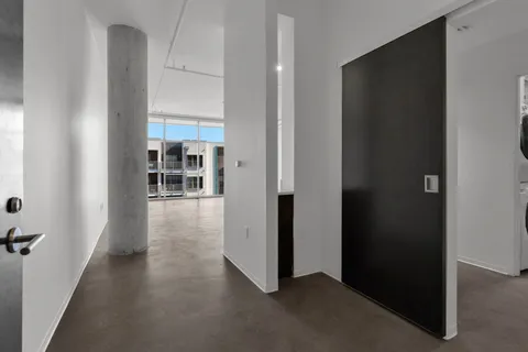 a living room with furniture granite and a large window
