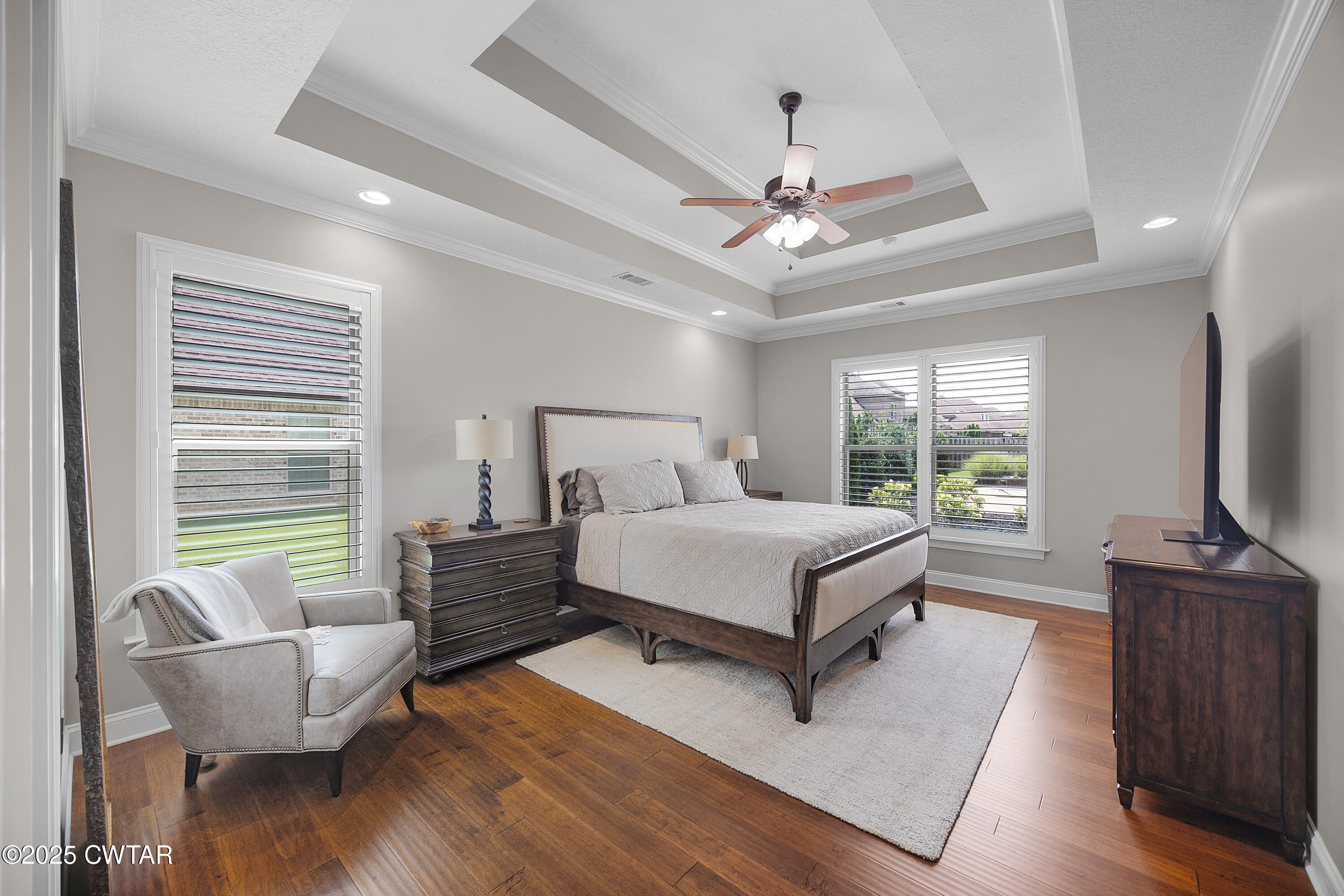 60 Cross Pointe Drive Jackson, TN 38305 - Photo 17 of 30 a bedroom with a bed and large windows