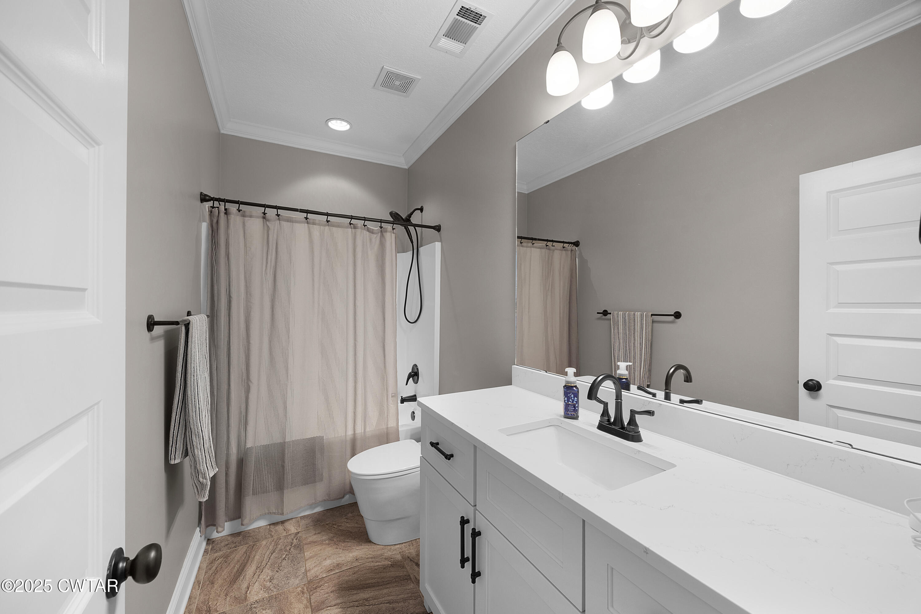 60 Cross Pointe Drive Jackson, TN 38305 - Photo 21 of 30 a bathroom with a sink a toilet a mirror and shower