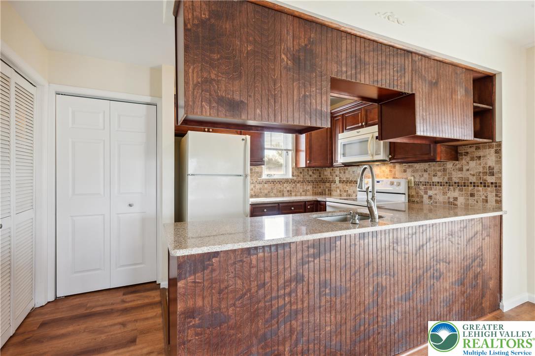 110 Drift Court, Unit B Bethlehem, PA 18020 - Photo 12 of 25 a room with stainless steel appliances wooden floor and a counter top space