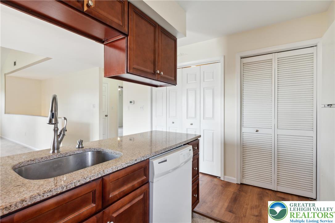 110 Drift Court, Unit B Bethlehem, PA 18020 - Photo 16 of 25 a kitchen with stainless steel appliances granite countertop a sink and a microwave