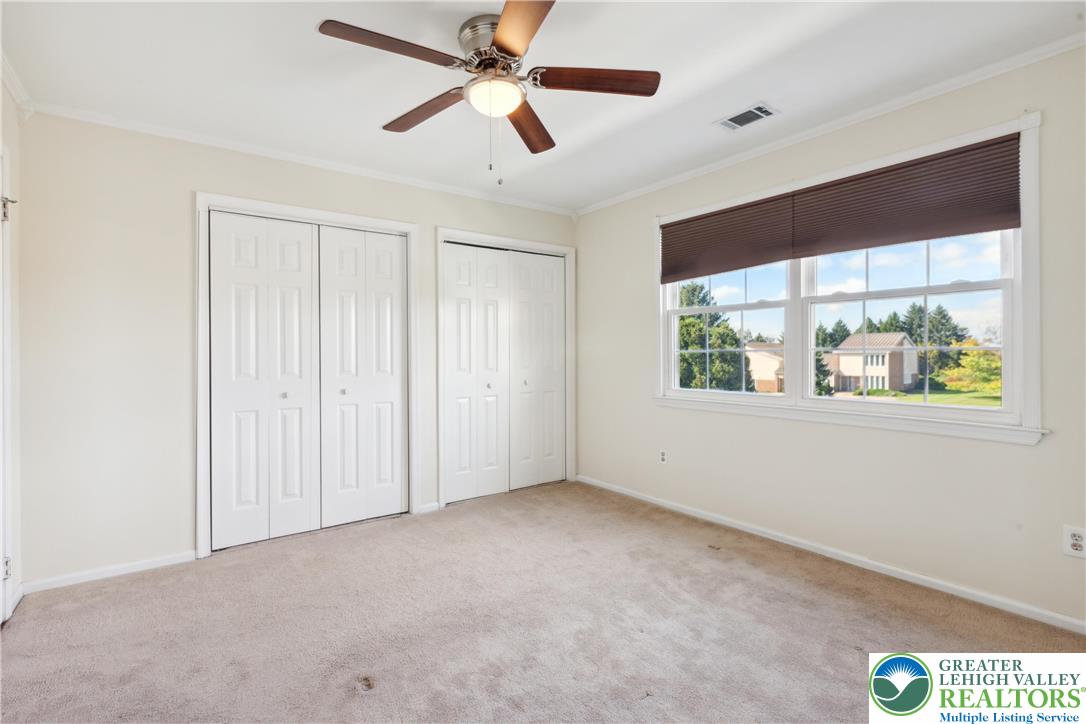 110 Drift Court, Unit B Bethlehem, PA 18020 - Photo 19 of 25 an empty room with windows and fan