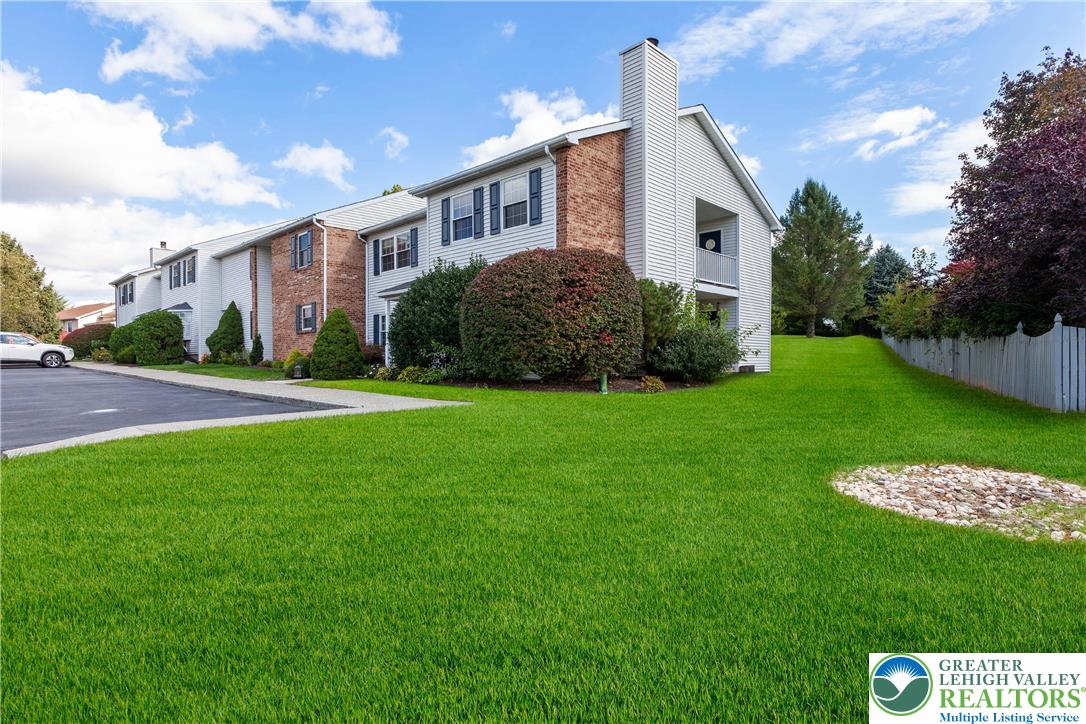 110 Drift Court, Unit B Bethlehem, PA 18020 - Photo 2 of 25 a front view of a house with a yard