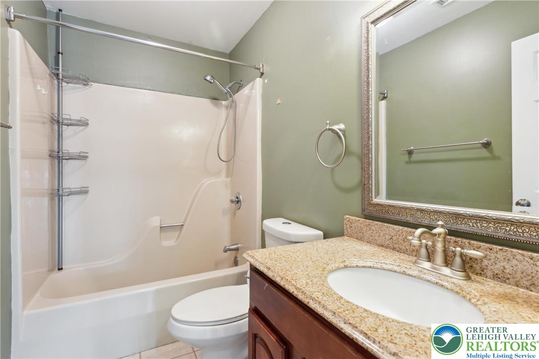 110 Drift Court, Unit B Bethlehem, PA 18020 - Photo 22 of 25 a bathroom with a granite countertop sink toilet and shower