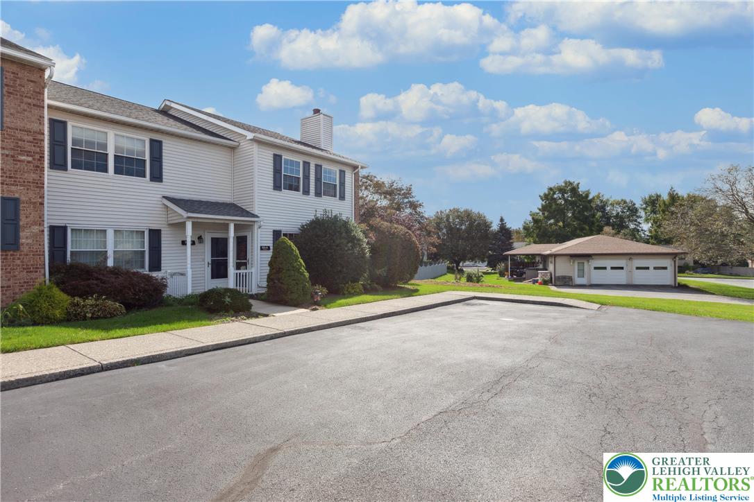 110 Drift Court, Unit B Bethlehem, PA 18020 - Photo 3 of 25 a view of swimming pool with an outdoor seating and a garden