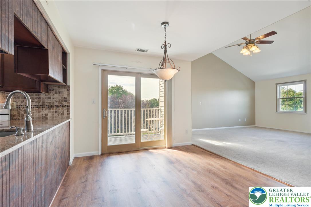 110 Drift Court, Unit B Bethlehem, PA 18020 - Photo 9 of 25 a view of an empty room with a window and wooden floor
