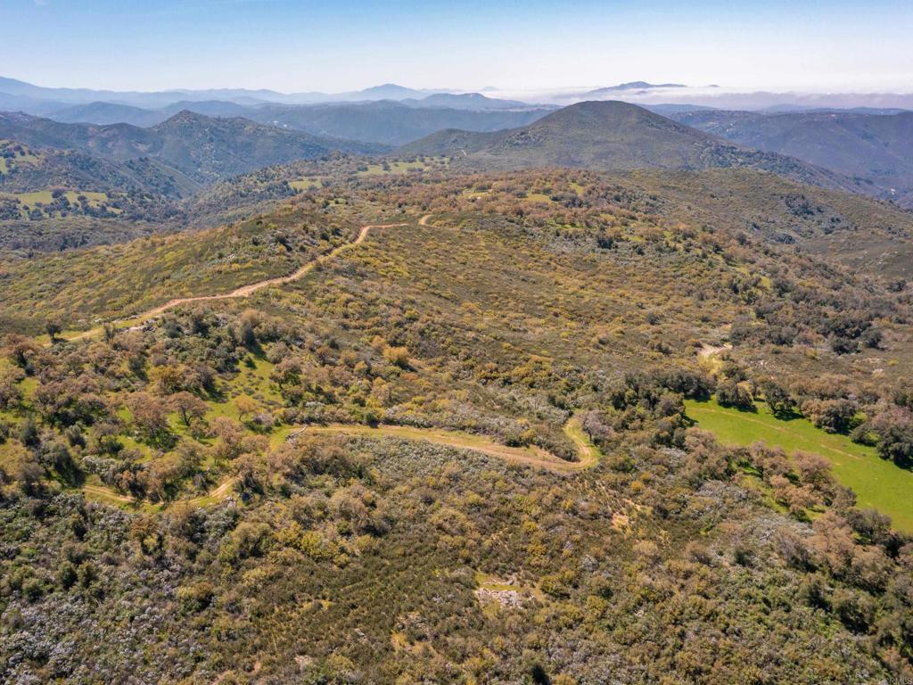 342-acres Mesa Grande Road Santa Ysabel, CA 92070 - Photo 24 of 42 a view of a lush green hillside and houses