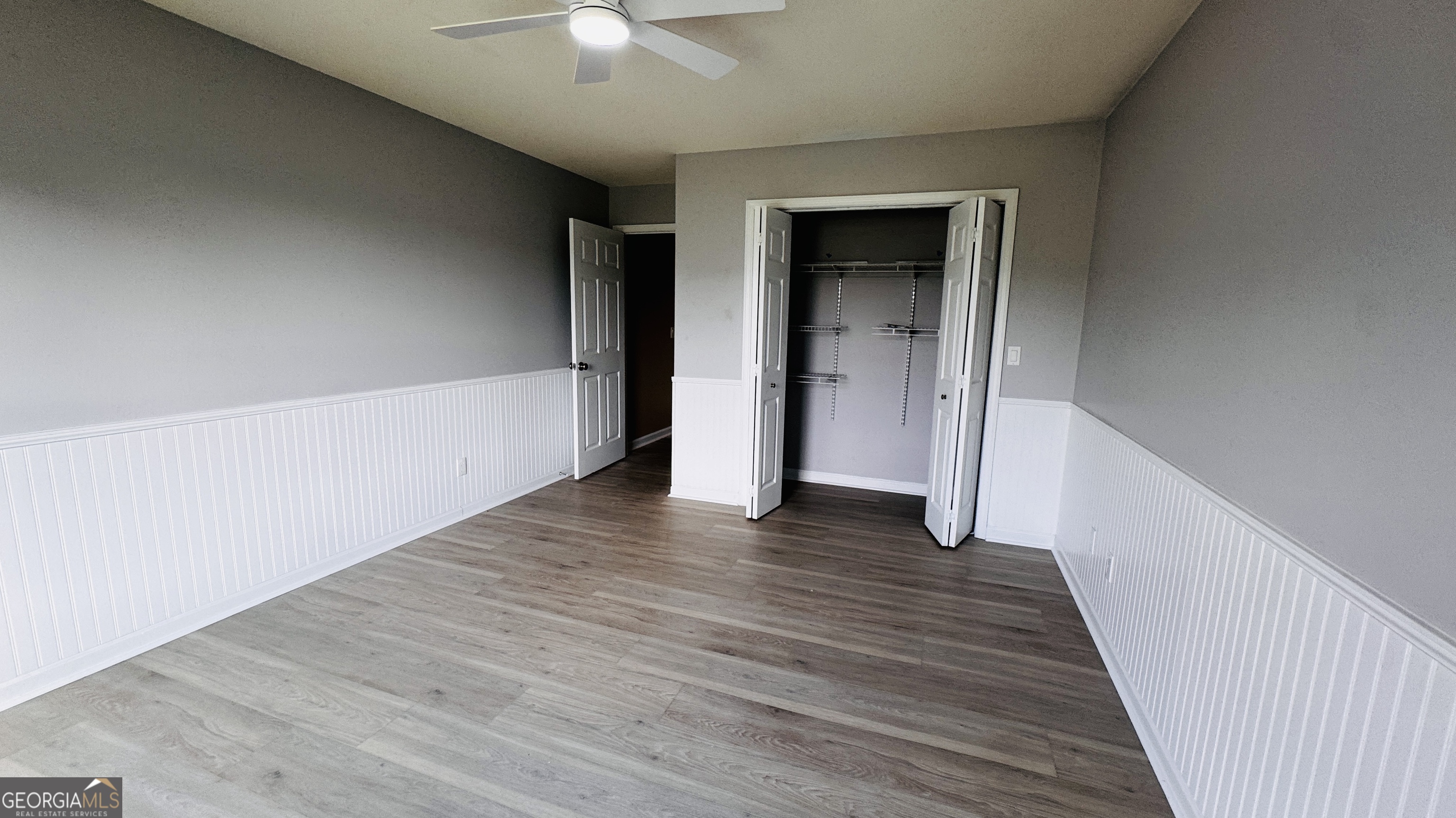 512 Antietum Road Collins, GA 30421 - Photo 12 of 16 a view of an empty room with wooden floor