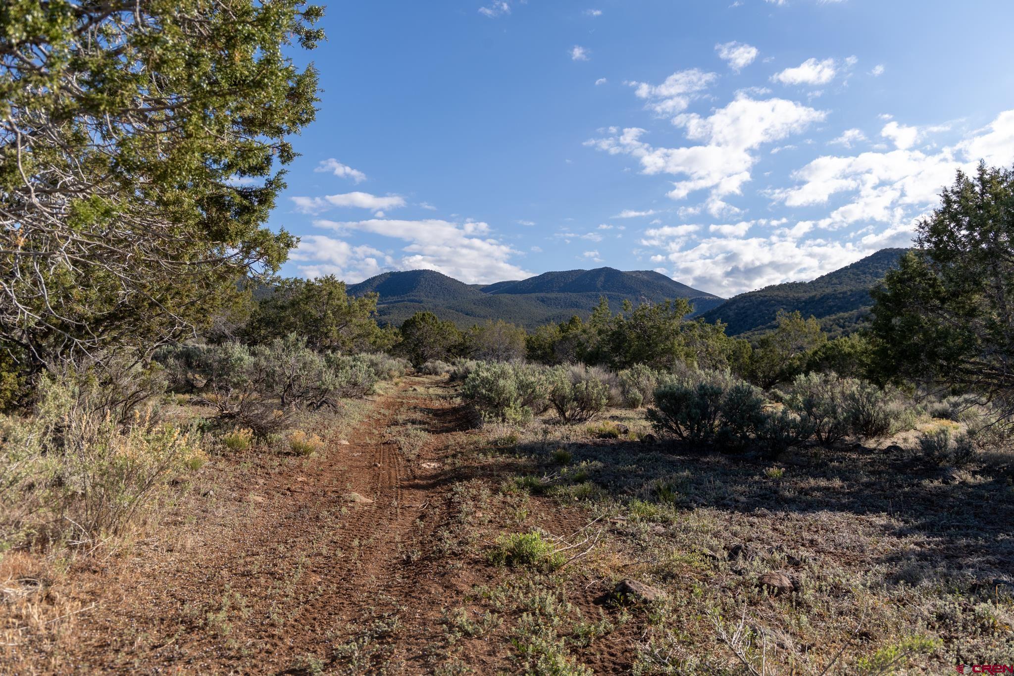 Tbd Powell Mesa Road Hotchkiss, CO 81419 - Photo 26 of 29 a view of a town with mountains in the background
