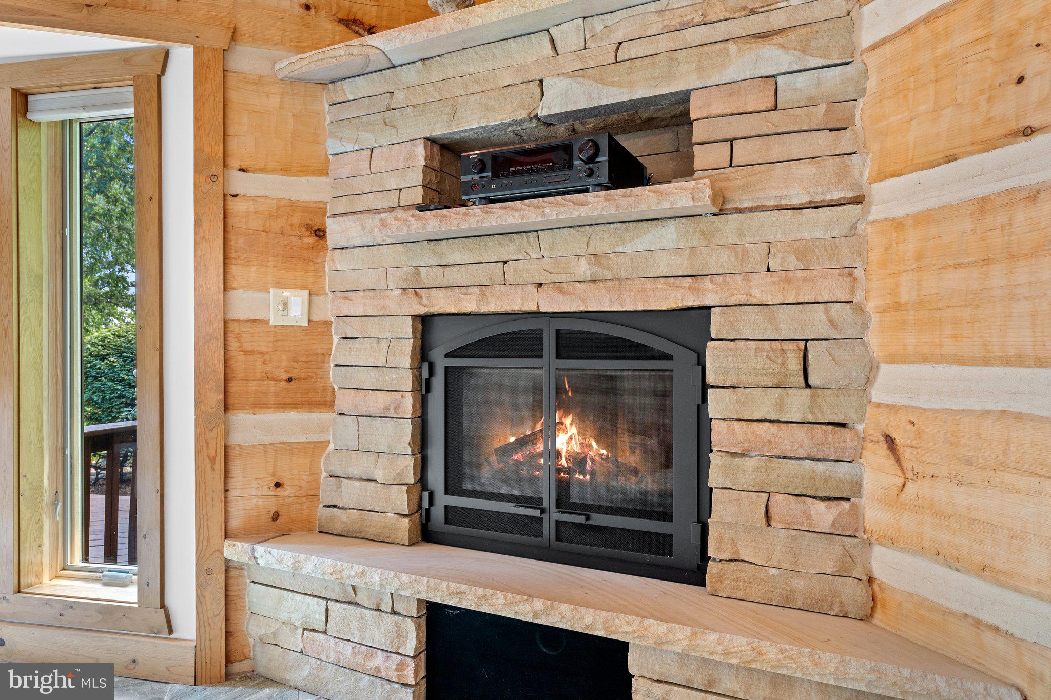 12904 Sagle Road Purcellville, VA 20132 - Photo 31 of 135 Gas fireplace in main level primary suite