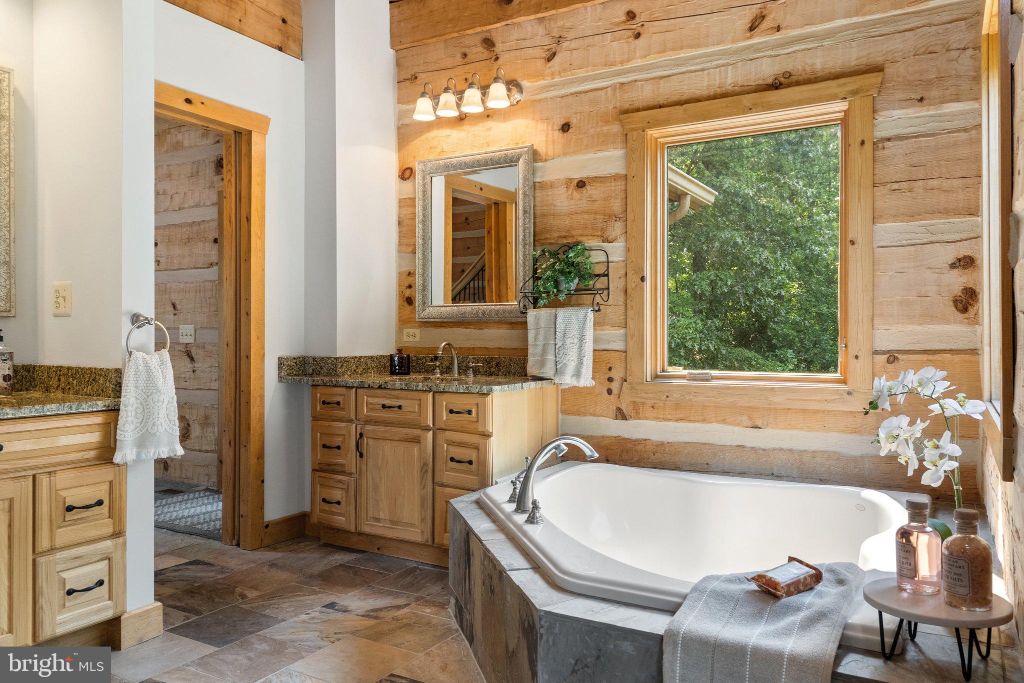 12904 Sagle Road Purcellville, VA 20132 - Photo 35 of 135 Main level primary bath soaking tub & 2 vanities