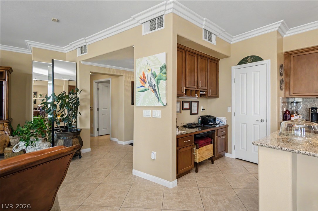 2555 Hampton Road, Unit 3308 Henderson, NV 89052 - Photo 22 of 65 Granite counters and rich wood cabinetry define this kitchen's functional elegance.