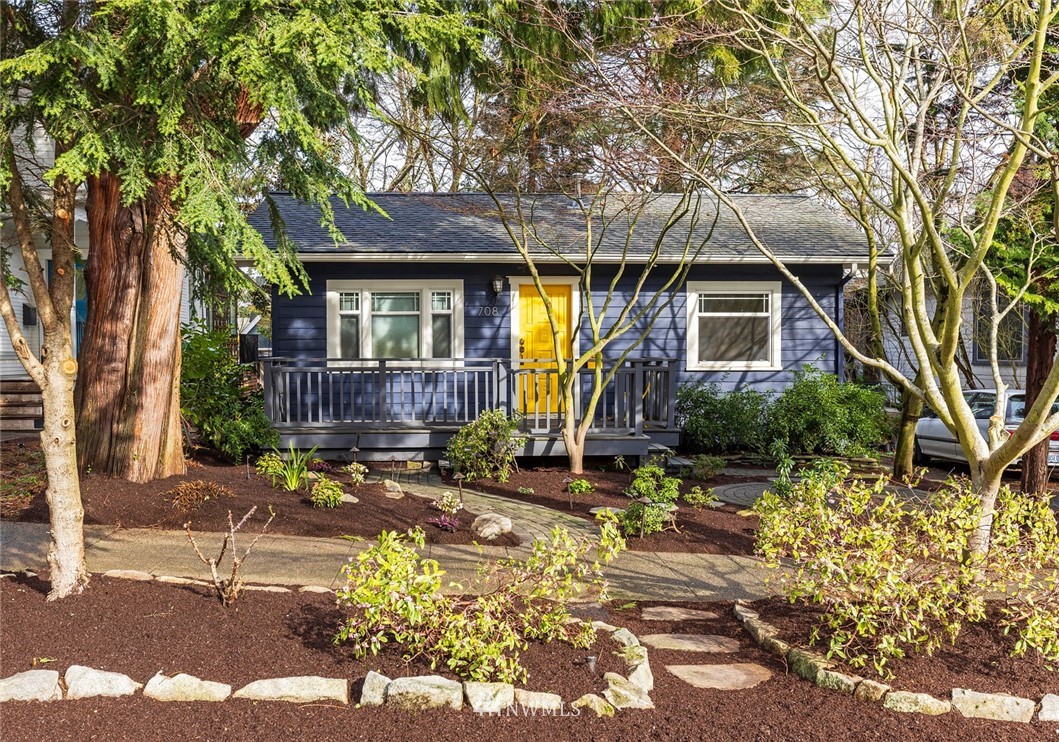 708 North 63rd Street Seattle, WA 98103 - Photo 1 of 24 a front view of a house with garden